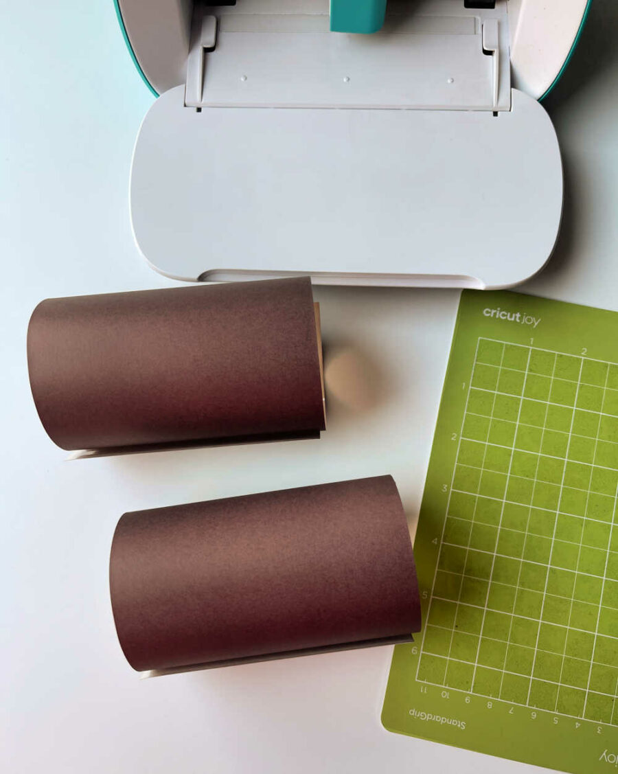 Cricut Joy and a sheet of black Cricut Infusible Ink