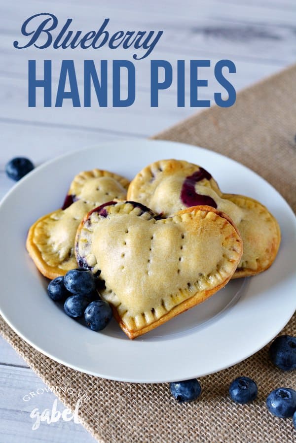 Hand pies are a fun dessert recipe perfect for lunches or when you're on the go! These blueberry hand pies are simple to make with homemade pie crust or store bought and an easy blueberry filling. Make them in any shape - but we love the hearts! Small heart shaped blueberry pies