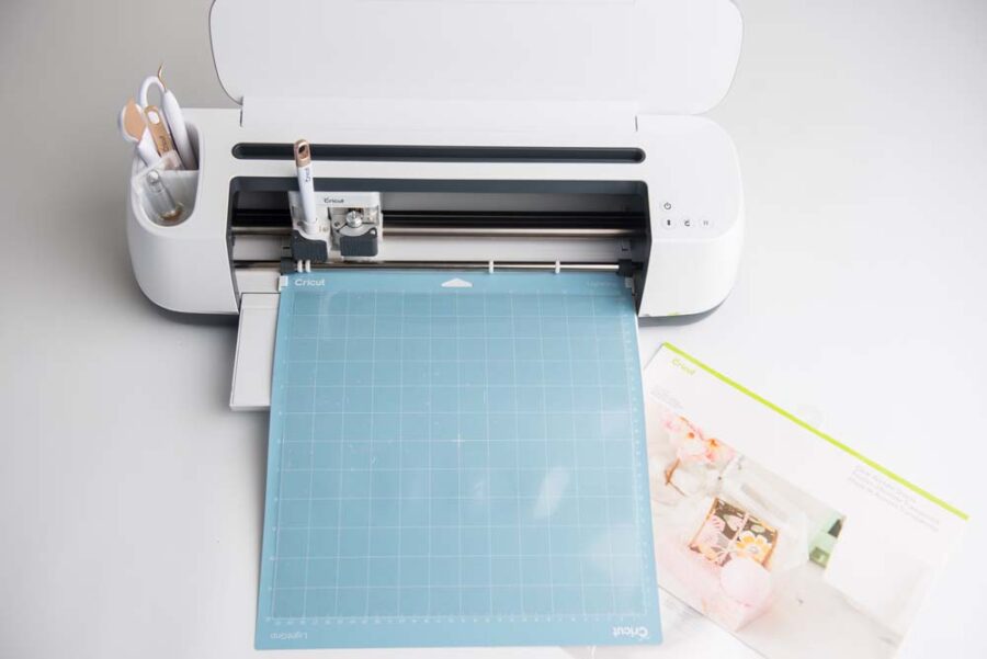 Acetate on blue cutting mat in Cricut Maker