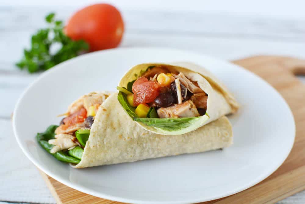 southwest chicken wraps cut in half on a plate
