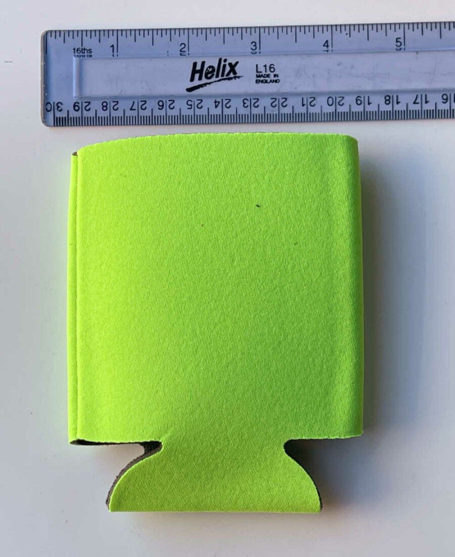 Ruler above a yellow can koozie