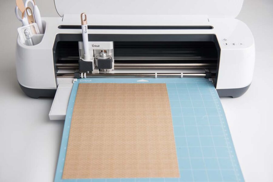 Cricut maker with LightGrip mat loaded with cardstock