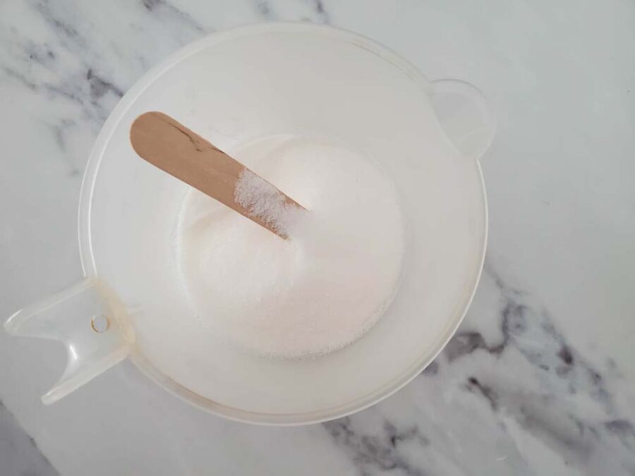 Melted soap base in a plastic cup