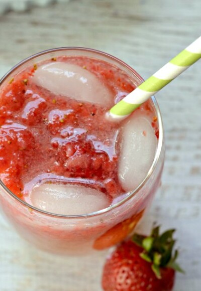 A quick and easy limeade recipe using fresh strawberries and lime essential oil for a refreshing summer drink!