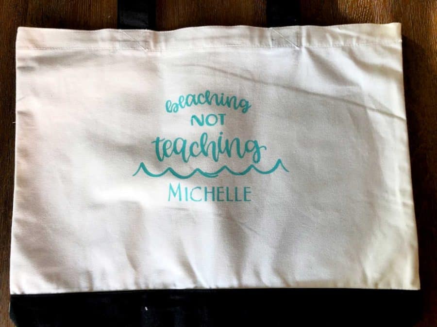 Finished Beaching Not Teaching tote bag on table