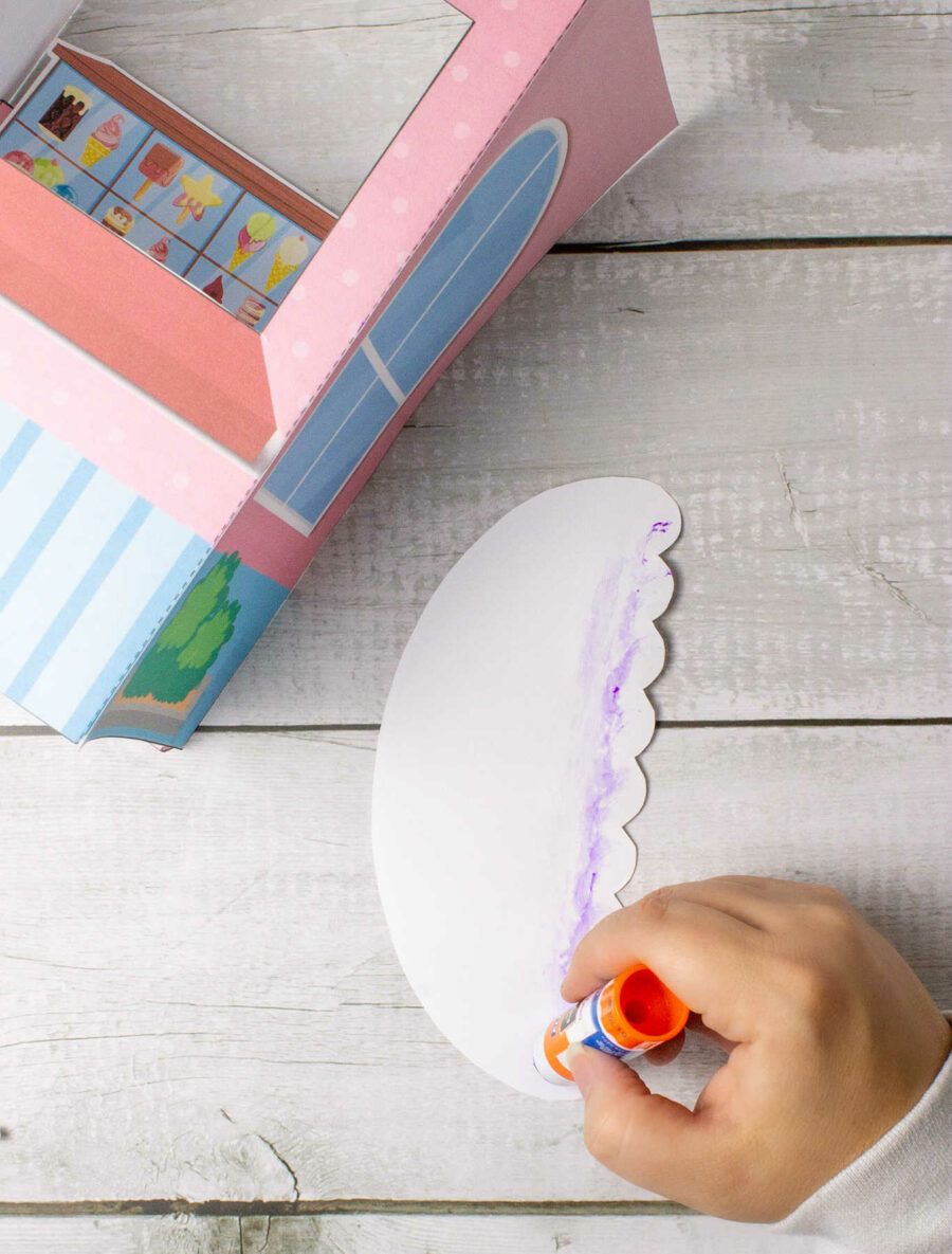 Adding glue to the ice cream shop awning