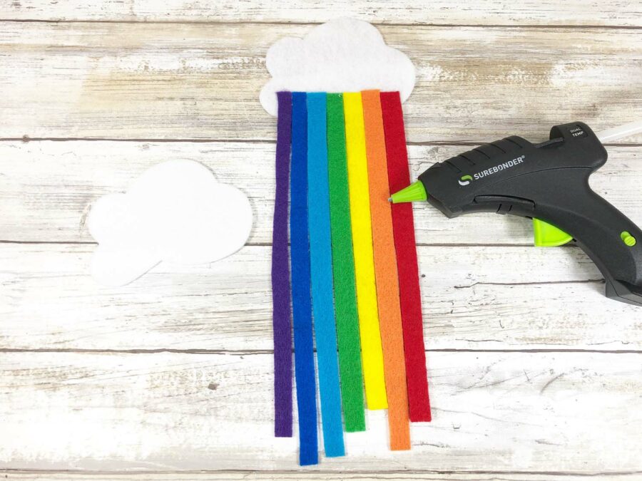 White felt clouds, rainbow felt pieces and a hot glue gun