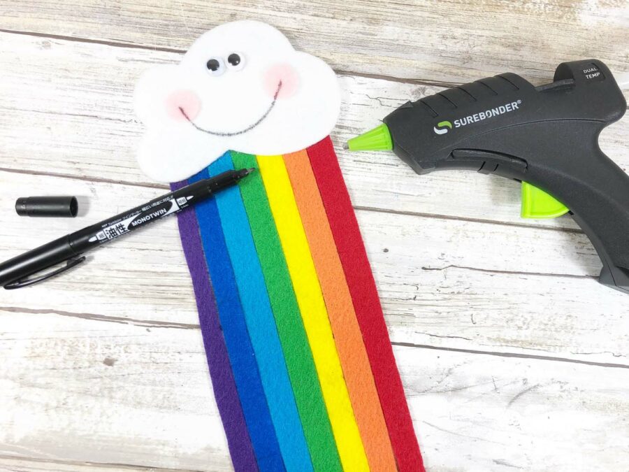 Rainbow felt bookmark with black marker and glue gun