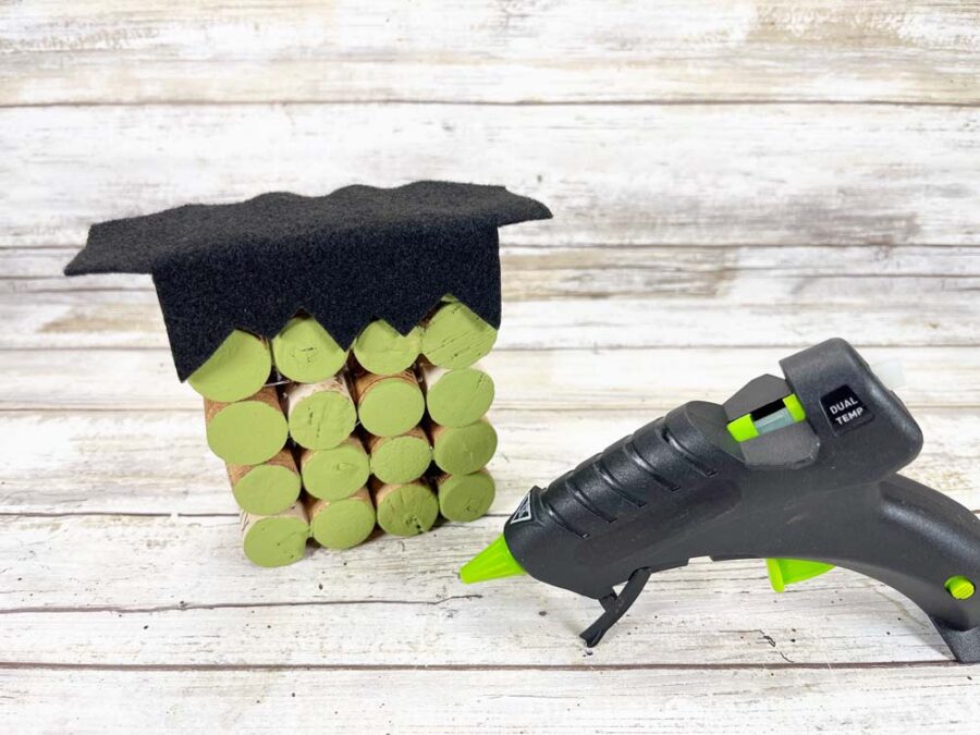 Frankenstein hair glued on top of wine corks and a glue gun