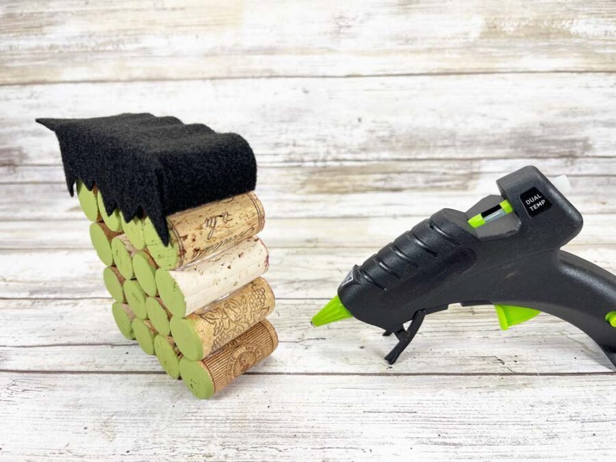 Sides of Frankenstein hair glued down and a glue gun