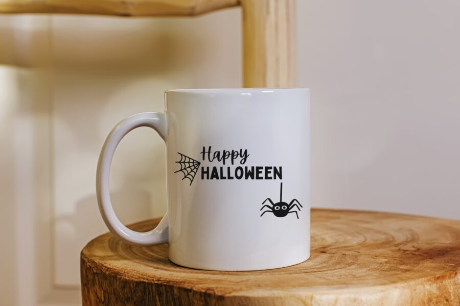 Happy Halloween SVG with a spider on a white coffee mug