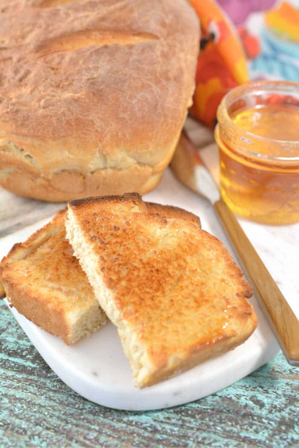 Slice of toast by a loaf of bread