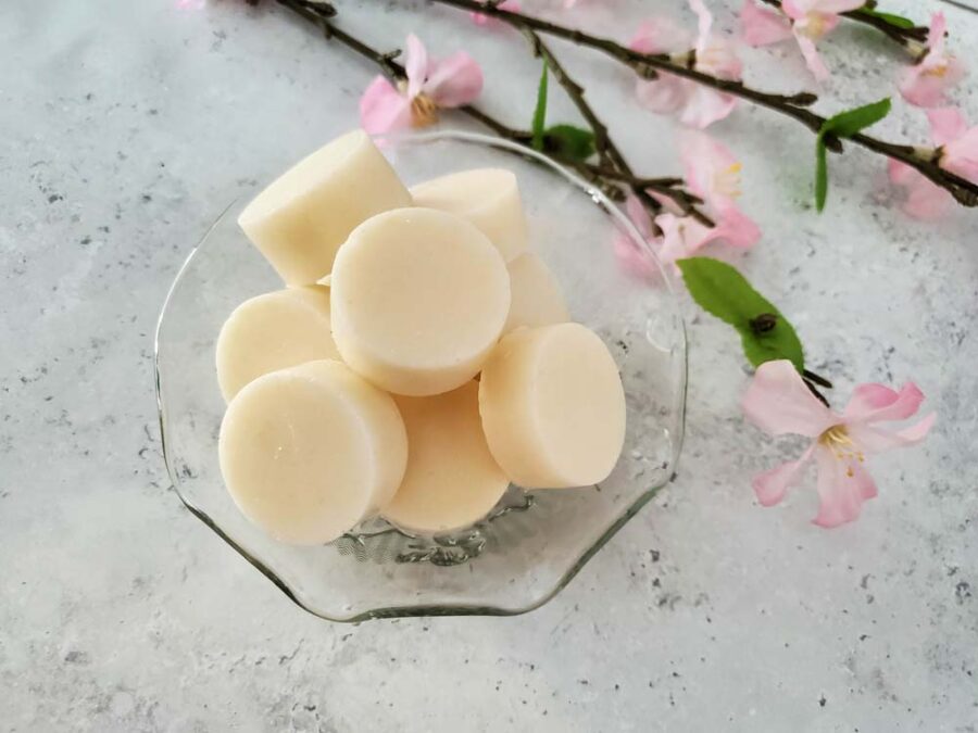 Homemade honey sugar scrub bars in a glass bowl