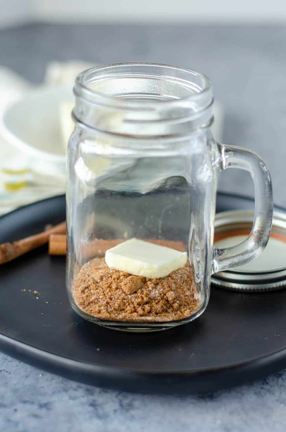hot buttered rum mix in a glass with butter