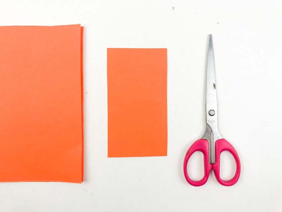 Orange paper and scissors