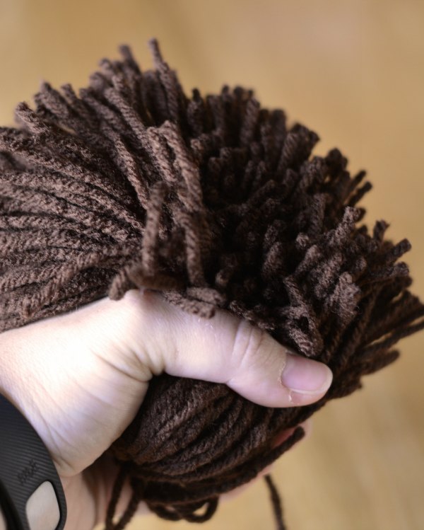 Brown yarn pom pom