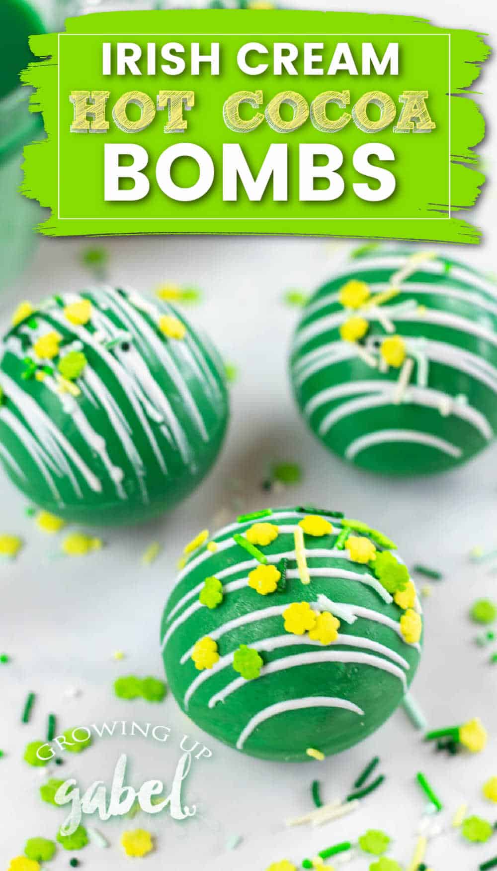 Hot chocolate bombs made with green and white chocolate are filled with Irish cream liqueur and hot chocolate mix. Drop the bombs in a mug of hot milk for a green and boozy hot chocolate drink.