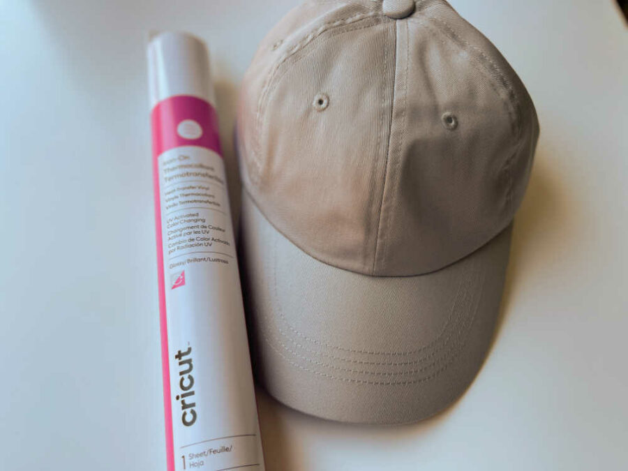 Blank hat with a roll of Cricut UV Activated Color Changing Iron on