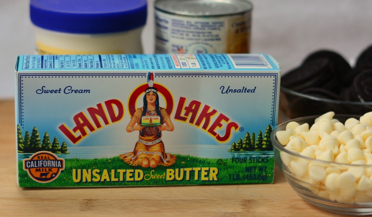 Supplies for cookies and cream fudge sitting on a wooden surface