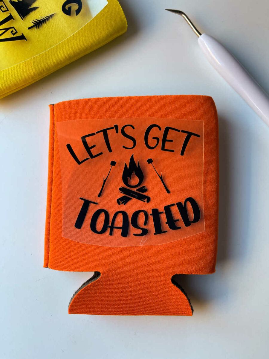 Let's get toasted cut in HTV on top of orange can koozie