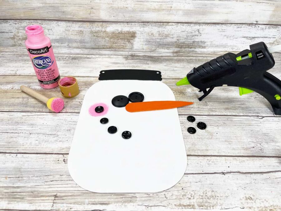 Adding face to the snowman sign