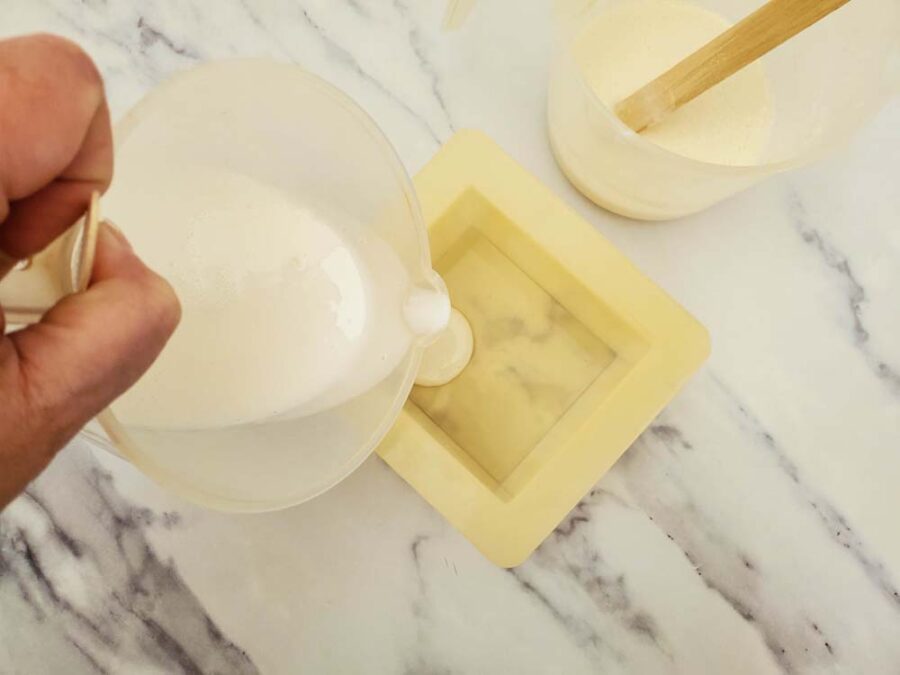 Pouring melted soap base into soap mold