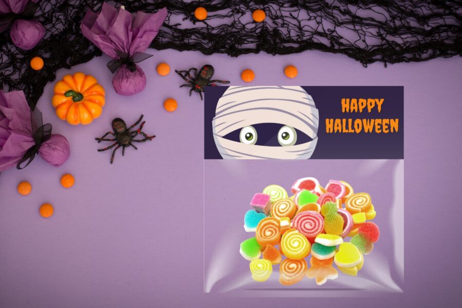 Mummy Halloween treat bag topper on a treat bag full of candy
