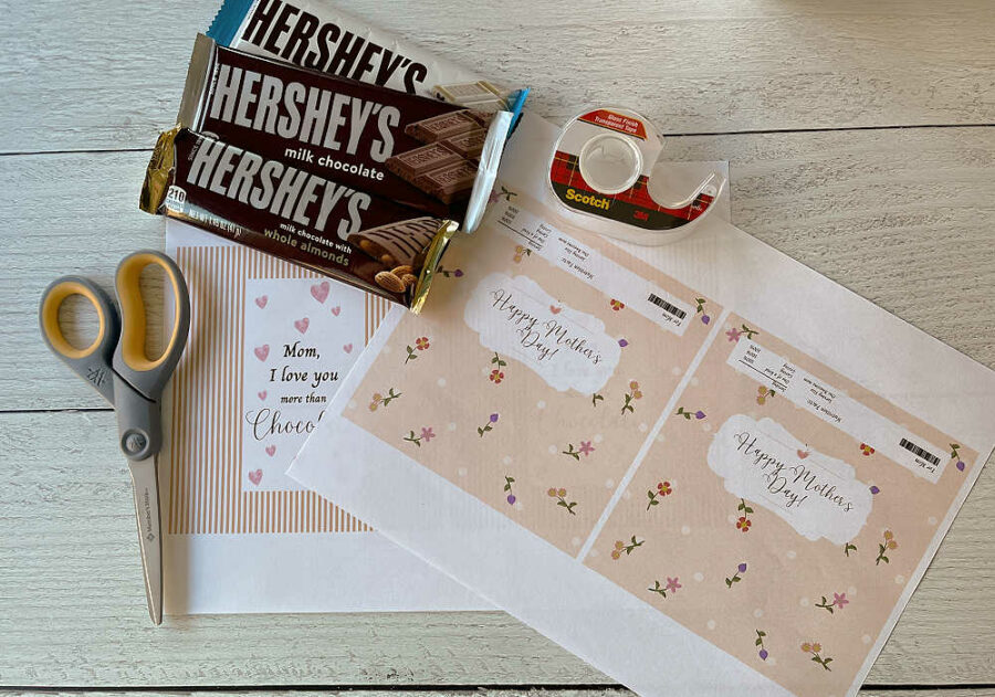 Candy bars, tape, wrappers, and scissors