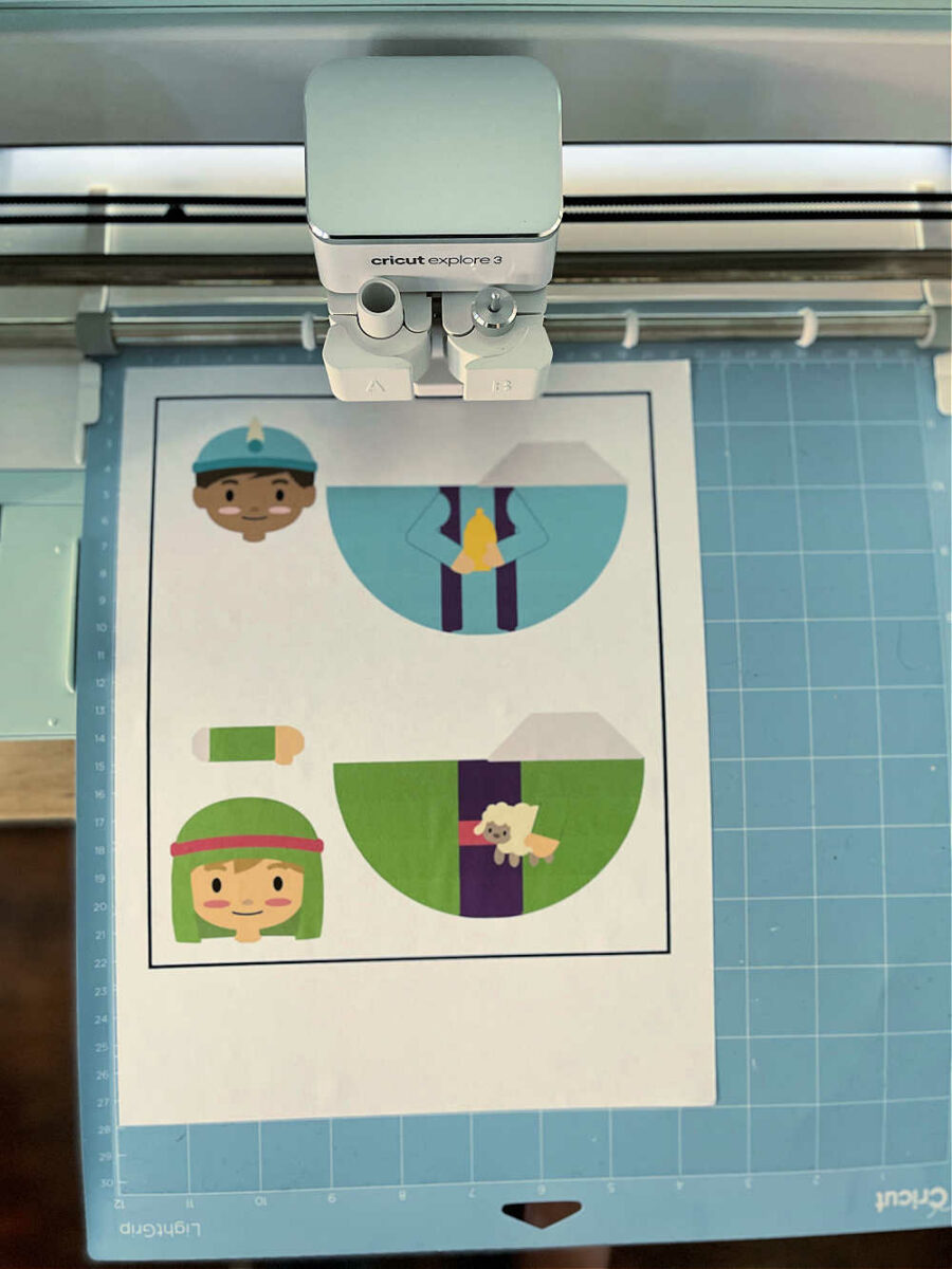 Nativity pieces being cut by a Cricut machine