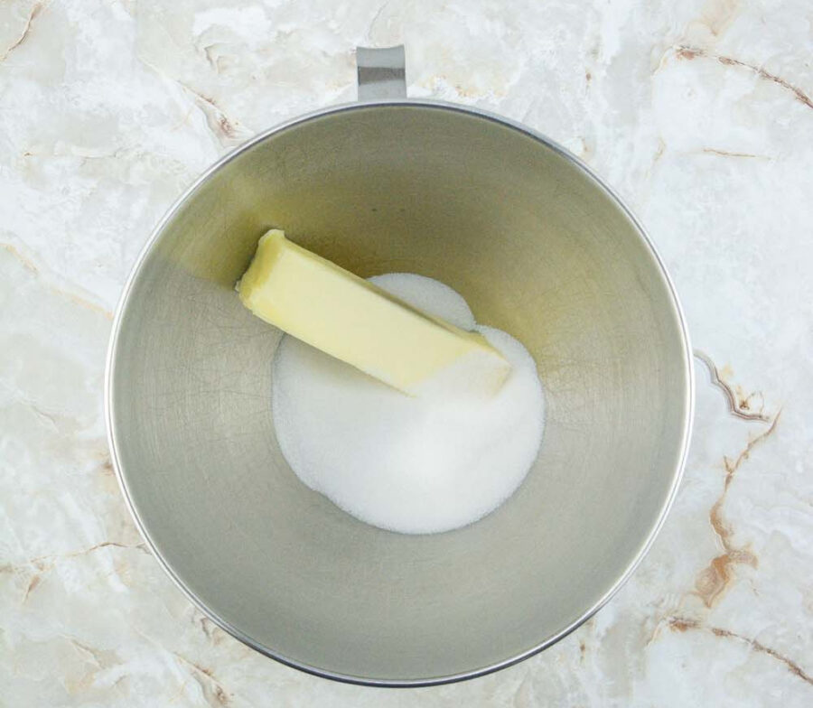 Sugar and butter in a mixing bowl