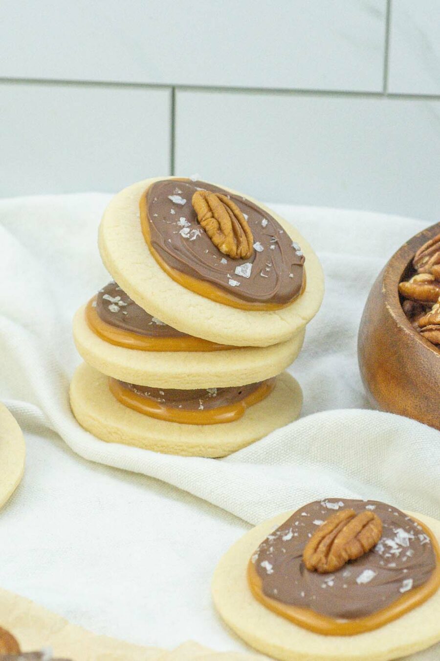 Stack of pecan turtle cookies