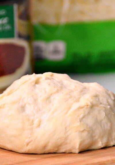 Just a few pantry ingredients will get this basic pizza dough recipe ready for baking in less than 10 minutes! | GrowingUpGabel.com