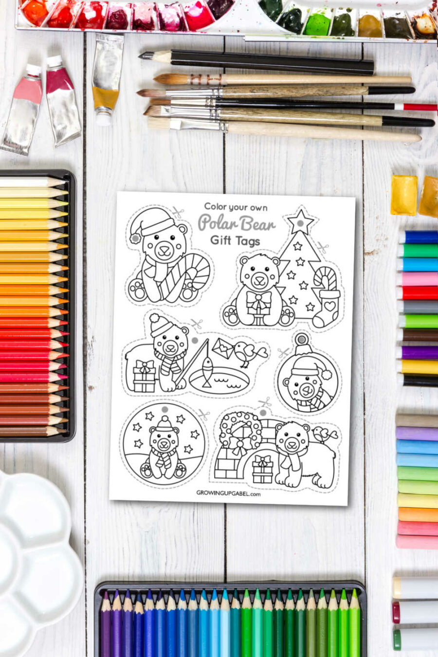 Polar bear gift tags on a table with art supplies