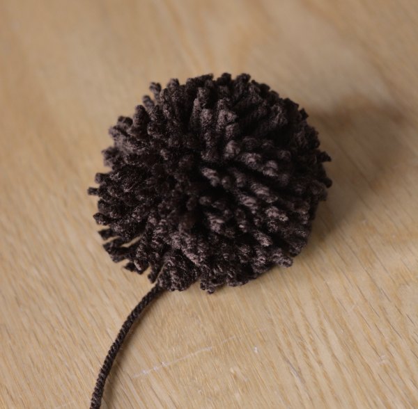 Brown yarn Pom Pom trimmed