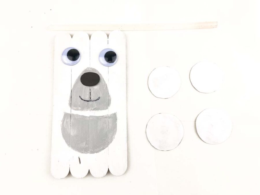 4 circles of paper and polar bear popsicle sticks