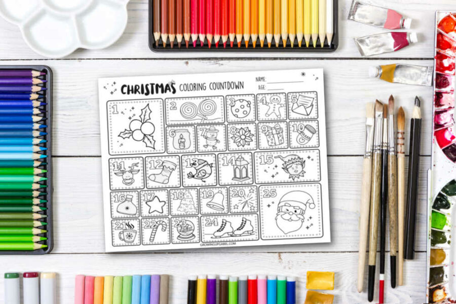 Christmas coloring countdown coloring sheet on a table with coloring tools