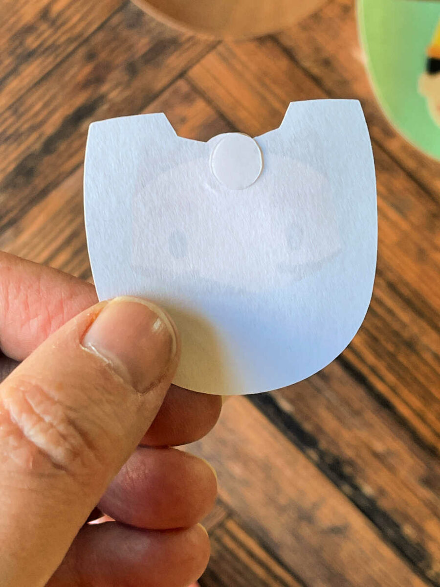 Mary's head with a glue dot on the neck