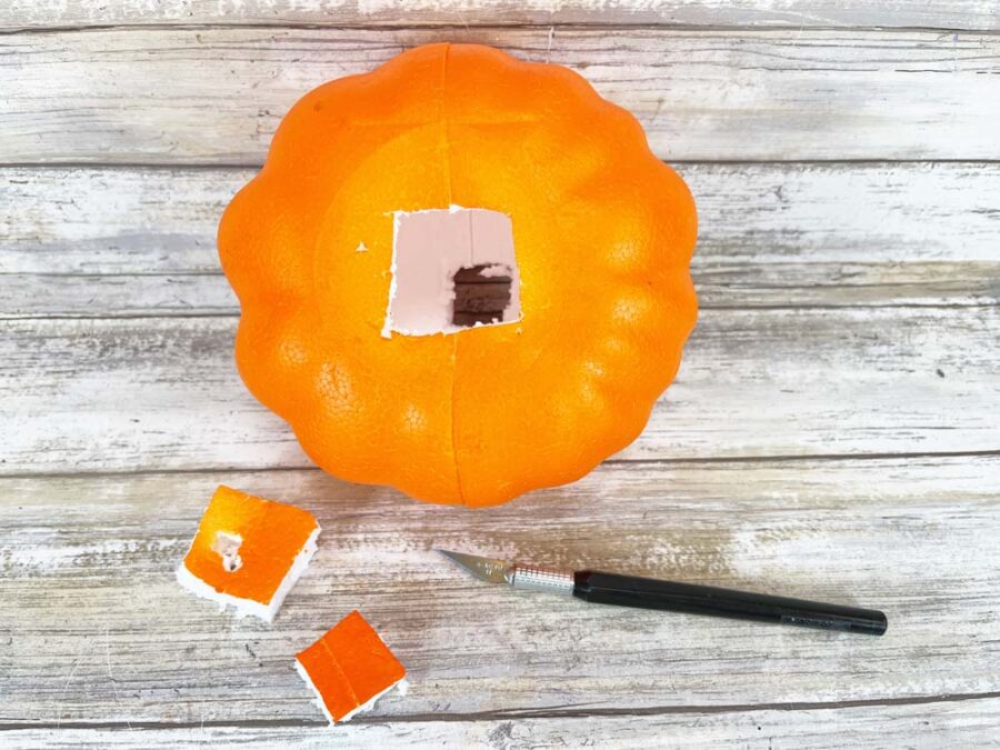 Foam pumpkin with hole cut out of top and bottom