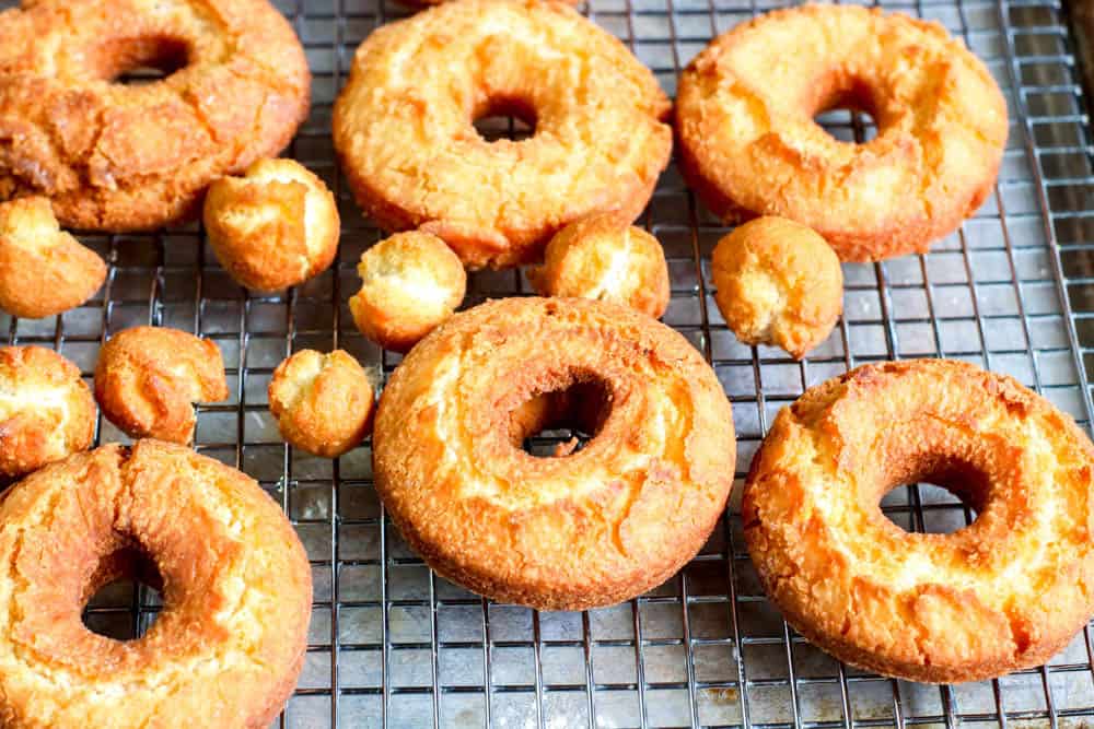 fried donuts on a cooling rack