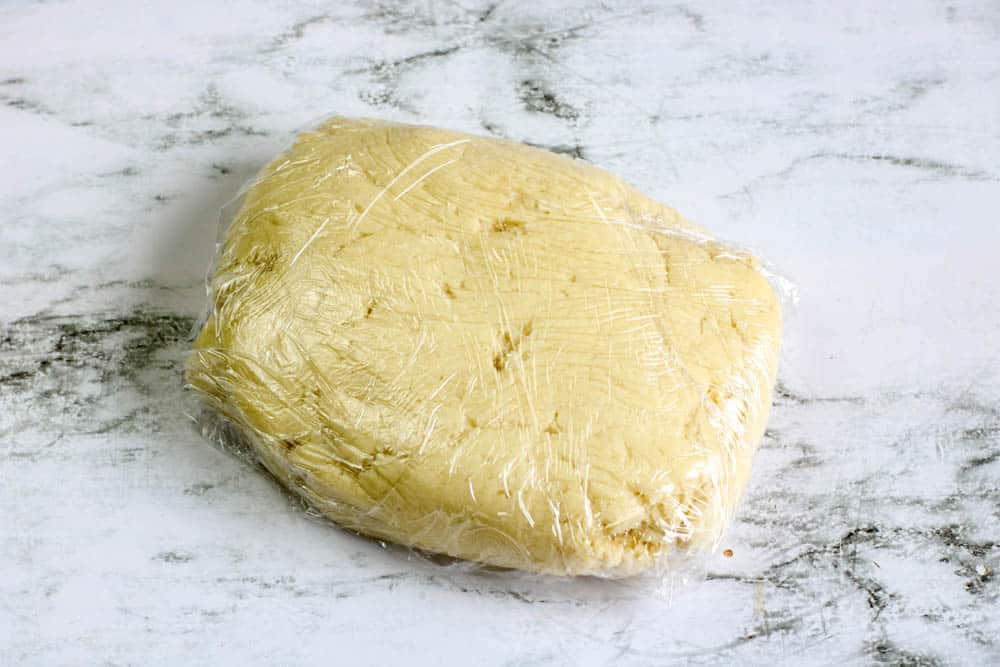 Donut dough wrapped in plastic wrap