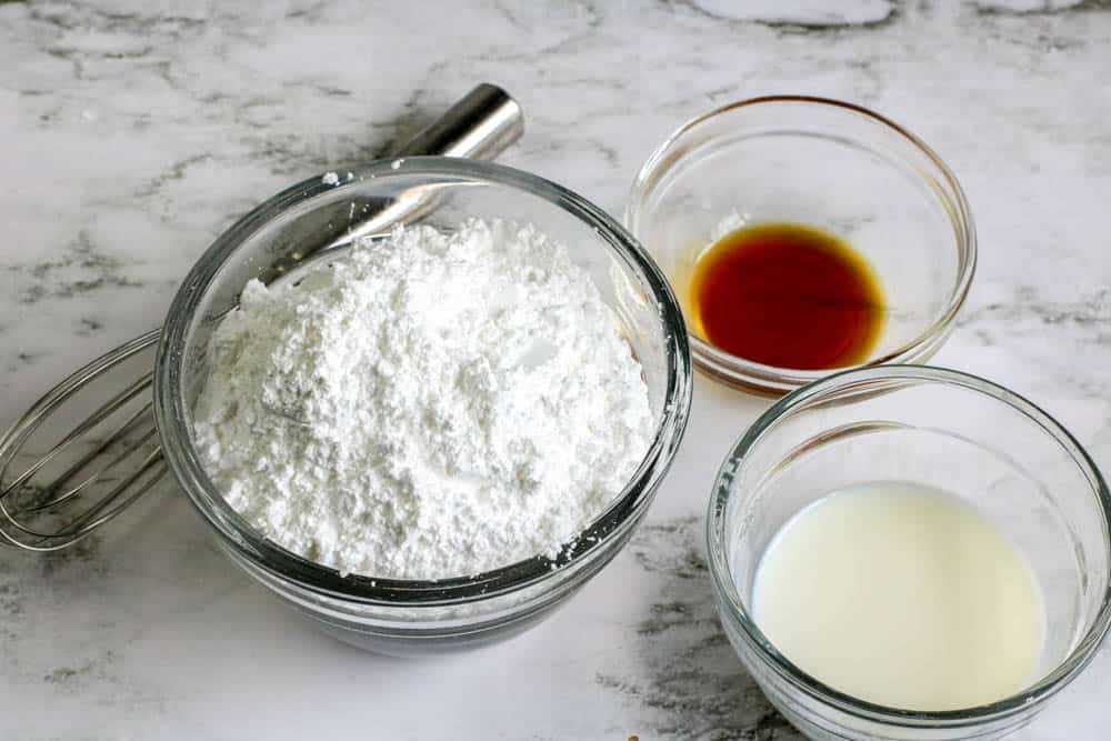 Powdered sugar, vanilla and milk in small bowls