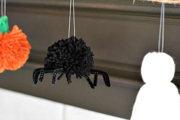 Spider made with yarn on a Halloween garland.