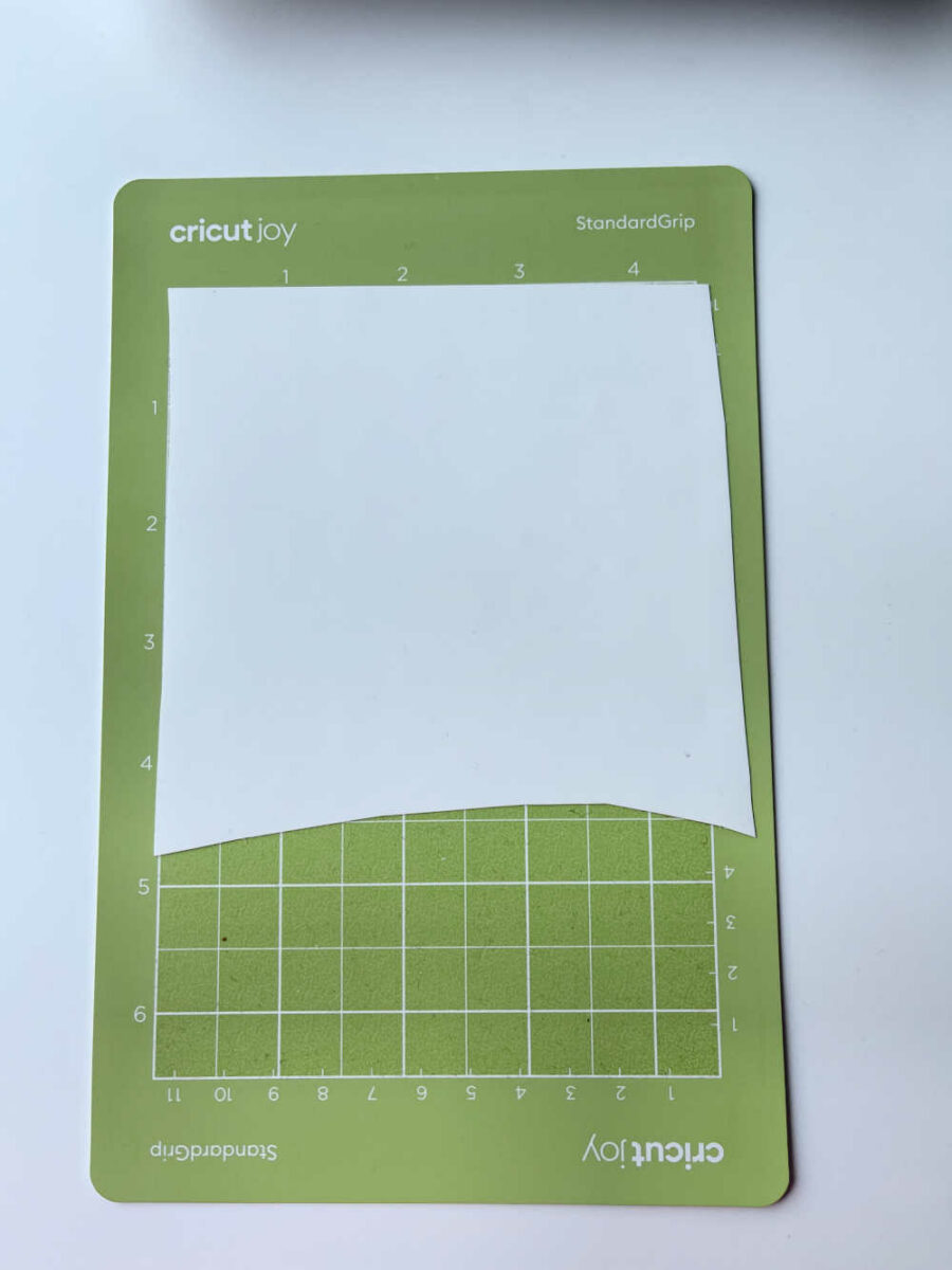 White HTV on Cricut Joy Standard Grip mat