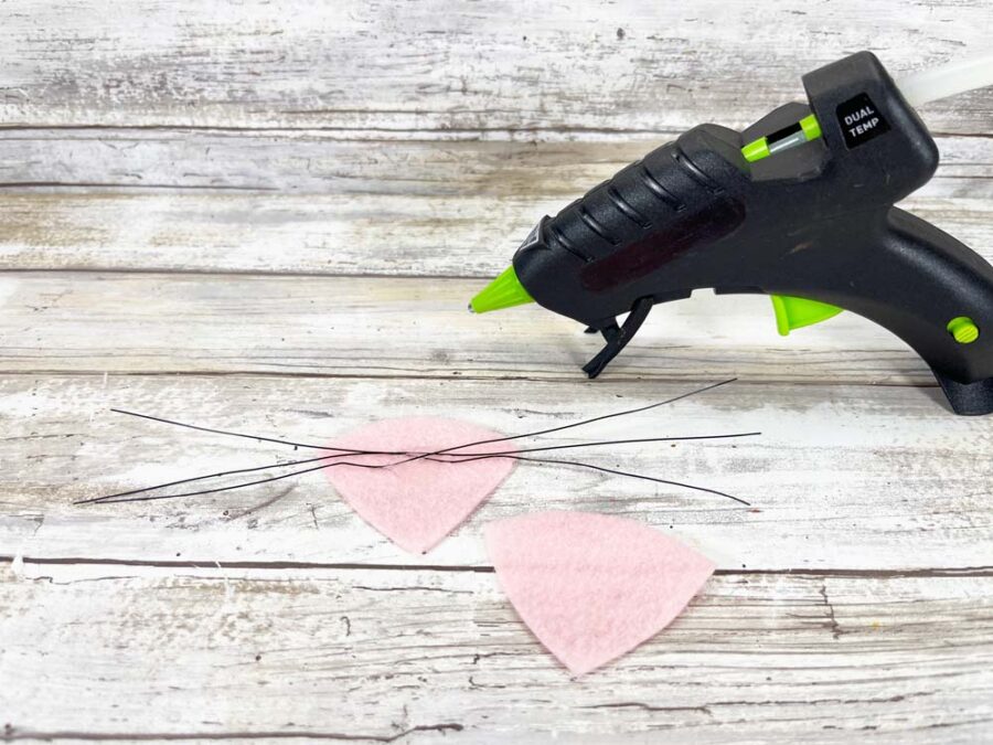 Pink felt piece with glue gun and wire