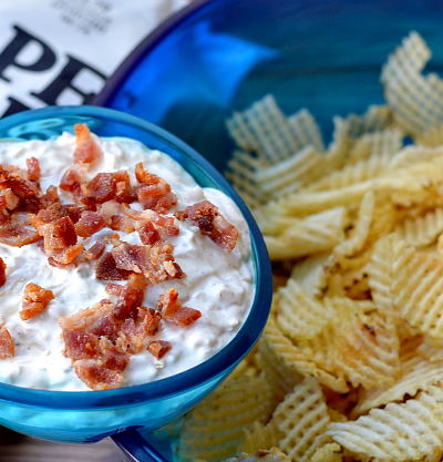 Need a delicious pot luck recipe? Look no further than this homemade potato chip dip. Made with sour cream, caramelized onions and bacon, you'll always bring home an empty dish.